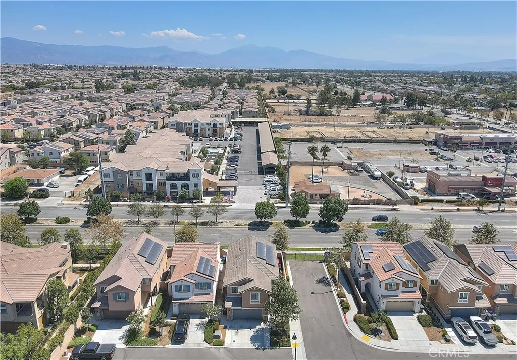 Aerial view of the home and surrounding neighborhood, highlighting its corner-lot location.