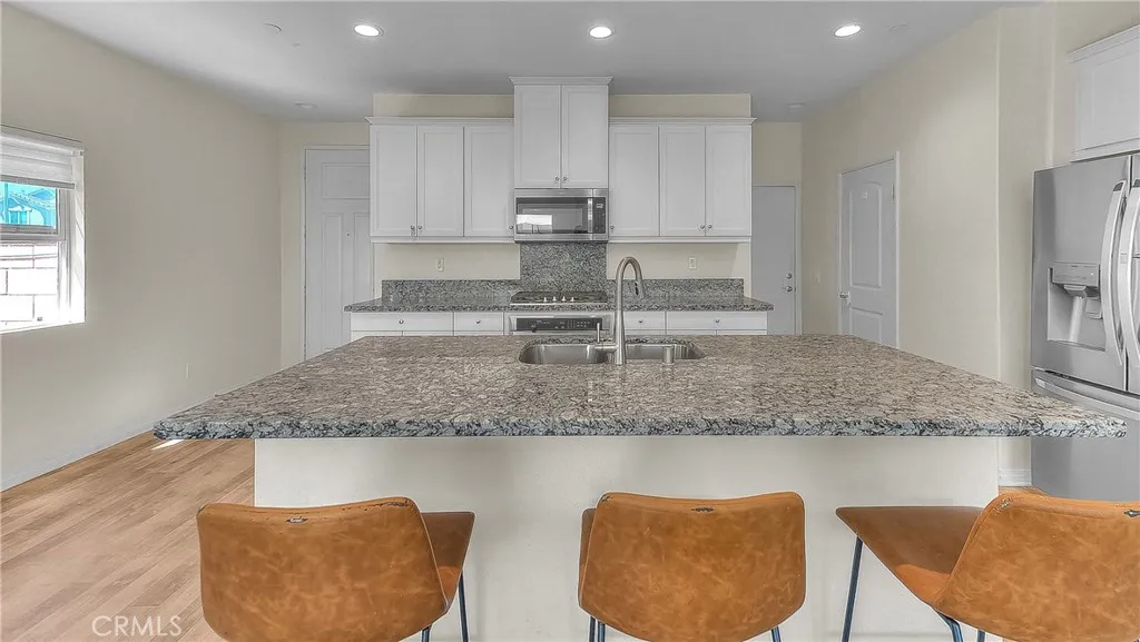 Inviting kitchen island creates the perfect spot to gather while meals are prepared.