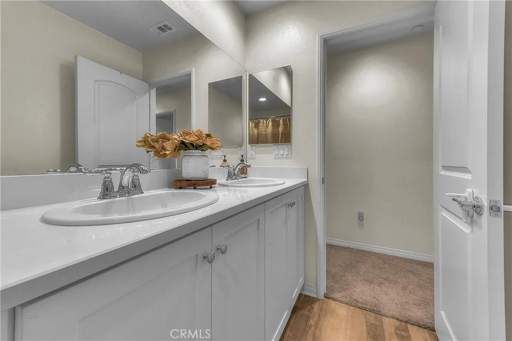 Clean and bright hall bathroom thoughtfully positioned for easy access.