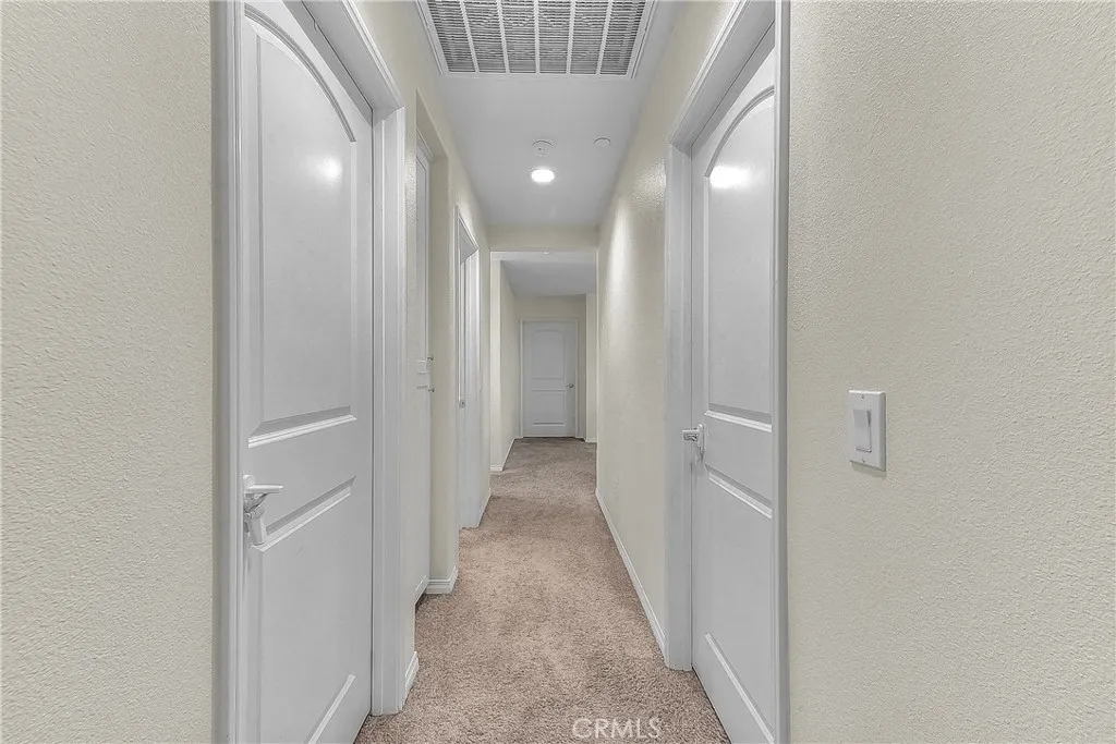 Thoughtfully designed hallway providing a natural flow throughout the home.
