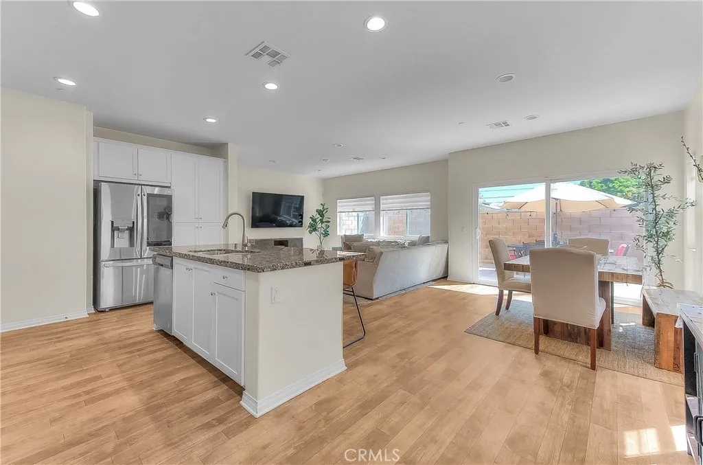 Open-concept kitchen creates a seamless connection to the dining and living areas.