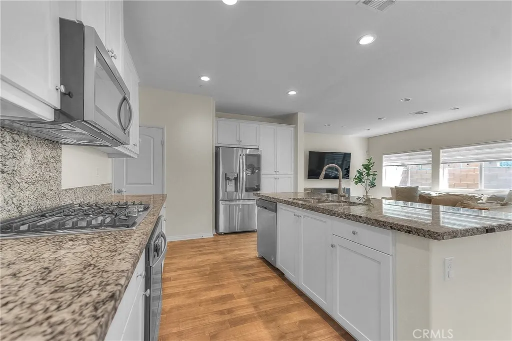 Bright kitchen offering abundant counter space and a functional layout for everyday cooking.