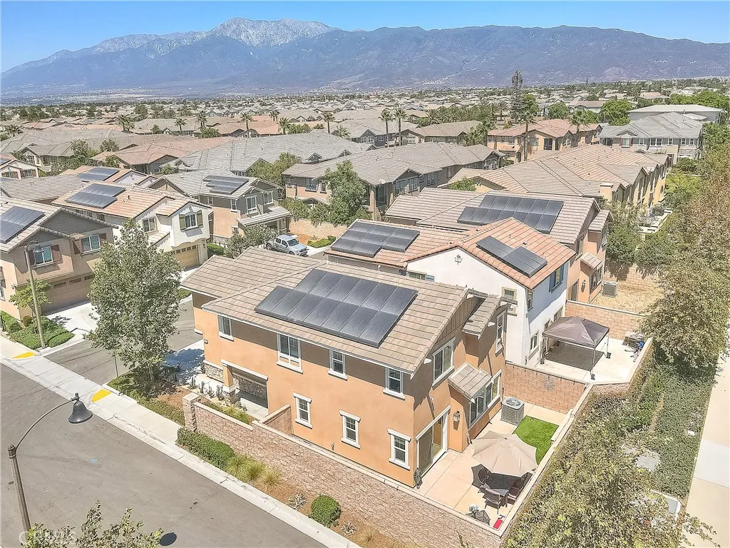 Aerial view showcasing the home’s desirable corner-lot setting and attractive exterior.