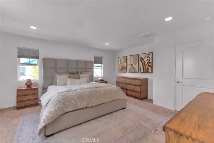 Private master retreat with a spacious layout and warm, inviting ambiance.