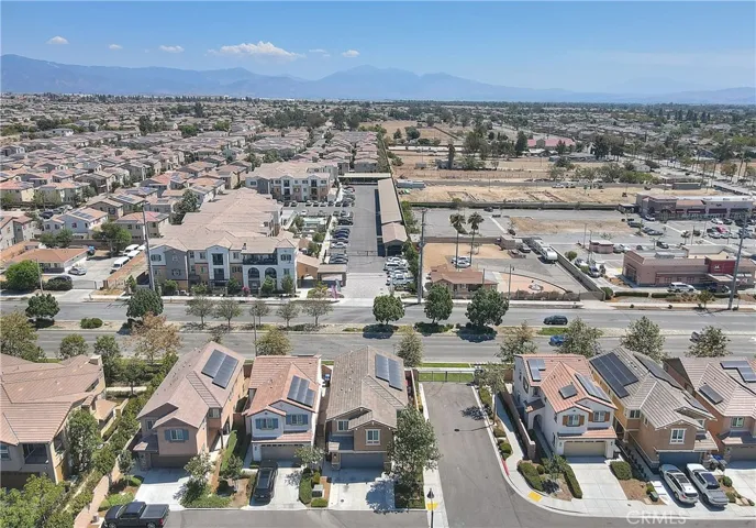 Aerial view of the home and surrounding neighborhood, highlighting its corner-lot location.