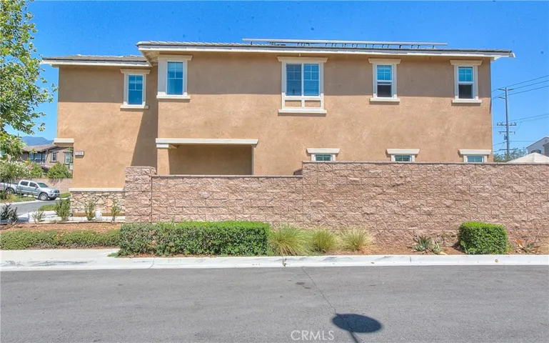 Full side exterior view showcasing the home’s attractive architecture and corner-lot setting