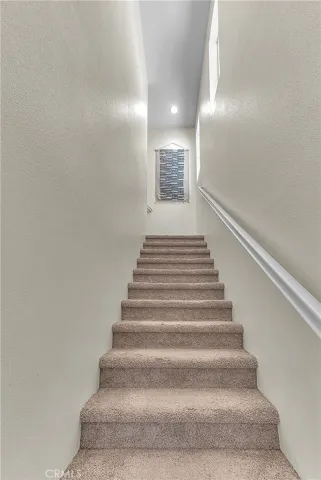 Bright stairway creating a seamless transition to the second floor.