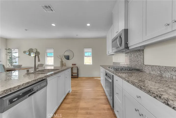 Functional kitchen island with an integrated double-basin sink and plenty of countertop space.