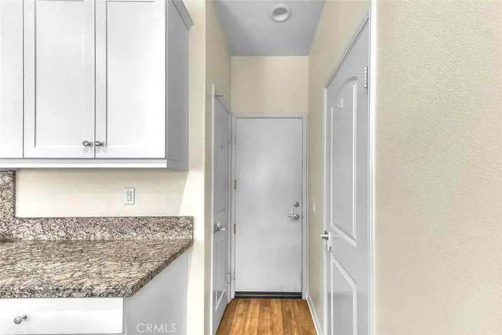 Convenient access to the garage, with the pantry and powder room on either side.