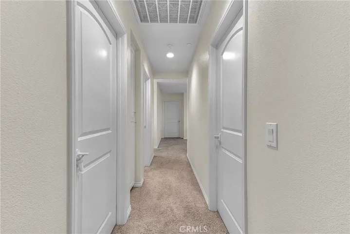 Thoughtfully designed hallway providing a natural flow throughout the home.