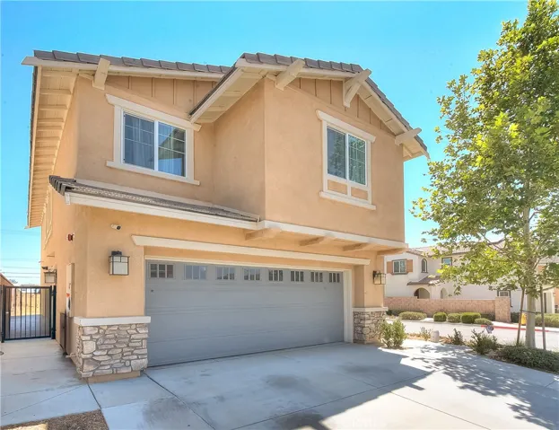 Inviting front exterior with attractive landscaping and desirable corner-lot positioning.