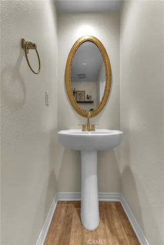 Stylish powder room located on the main level for added convenience.