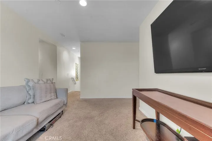 Versatile loft/den offering a flexible space for a home office, study, or relaxation area.