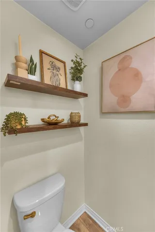 Convenient downstairs powder room, perfect for guests and everyday use.