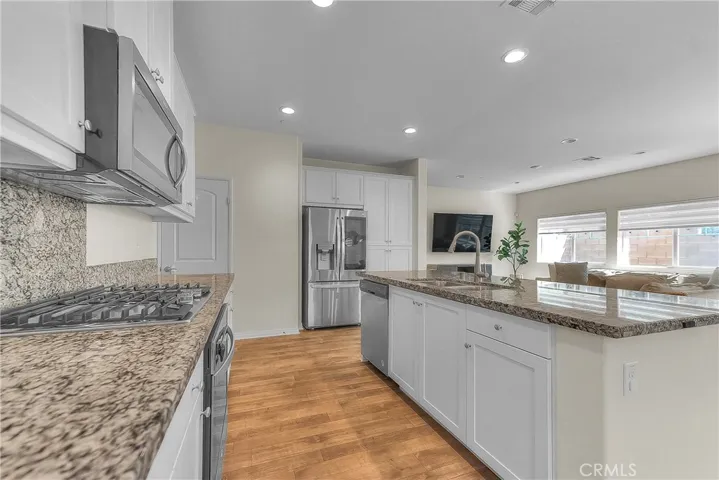 Bright kitchen offering abundant counter space and a functional layout for everyday cooking.