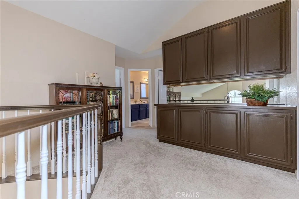 Upstairs hallway with ample built-in linen storage.