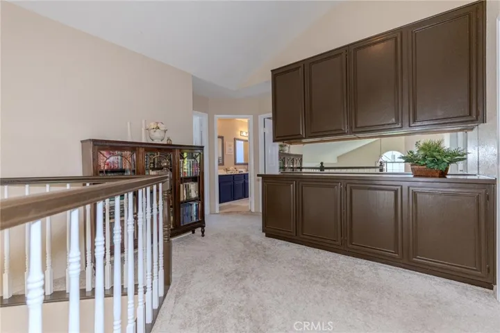 Upstairs hallway with ample built-in linen storage.