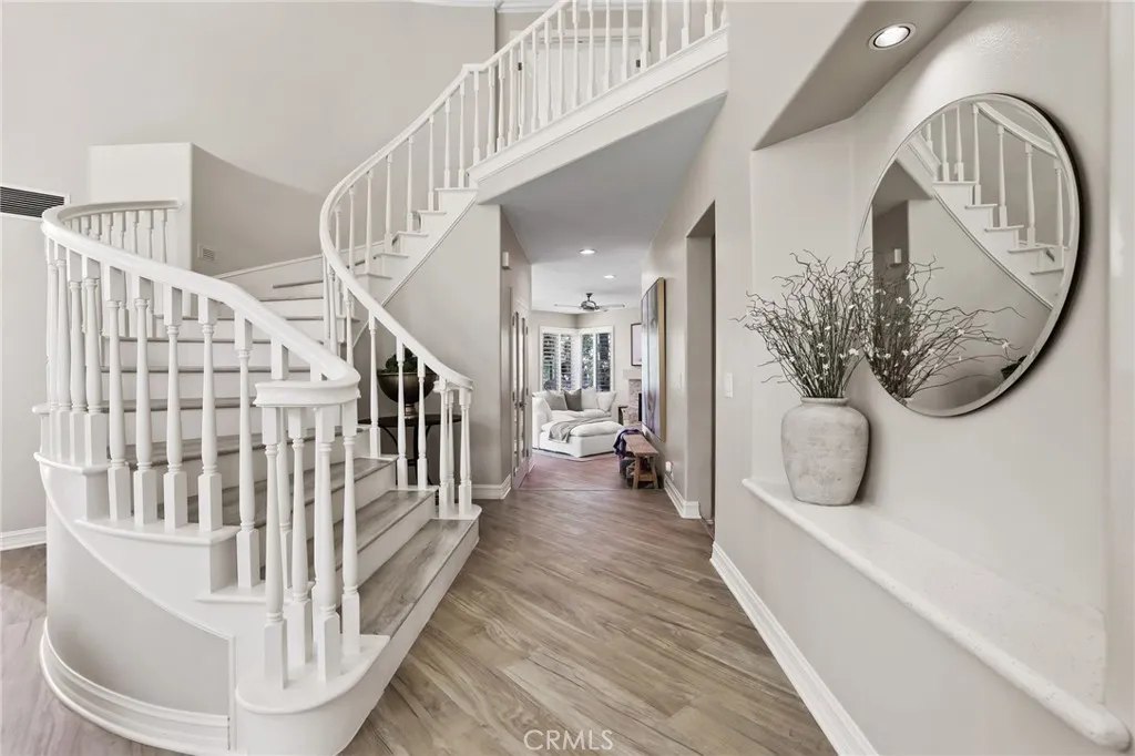 Stunning wide plank floors throughout~sweeping staircase leads to 4 upstairs bedrooms Stunning wide plank floors throughout~sweeping staircase leads to 4 upstairs bedrooms