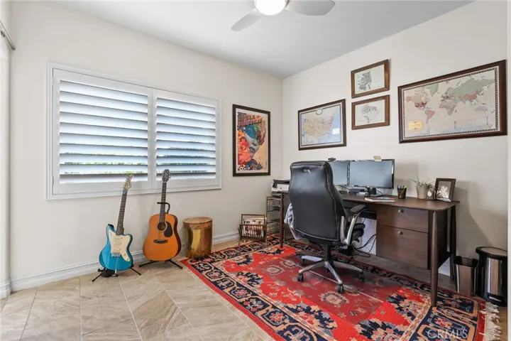 A versatile main floor bedroom makes a perfect home office, guest suite or music room