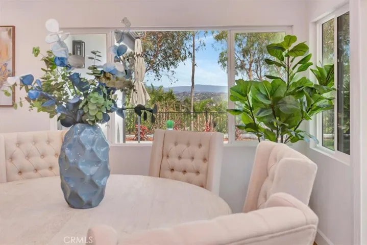 FROM DINING AREA YOU SEE THE VIEWS OUT THE NEW LARGE PICTURE WINDOW