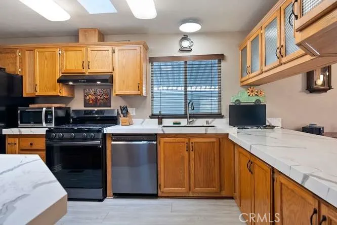 Kitchen with new appliances and Caesarstone Counters