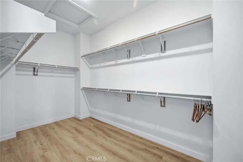 Primary Bedroom's Walk-In Closet Primary Bedroom's Walk-In Closet