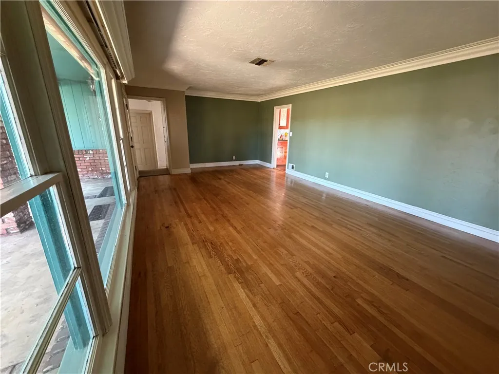 Living room w/ big picture window to front yard