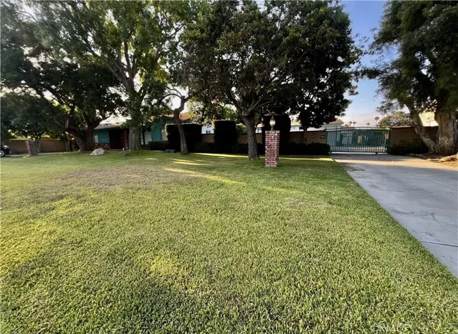 Driveway 2 on right with gated entrance to garage in back