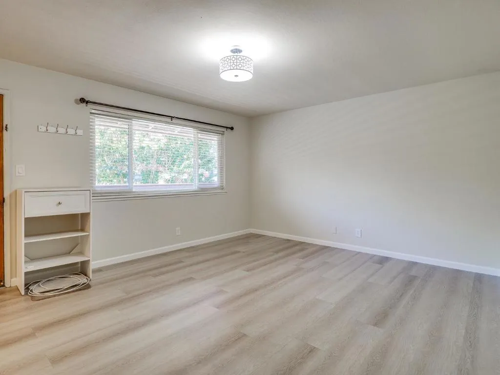 Living Room with newer hardwood flooring. Living Room with newer hardwood flooring.