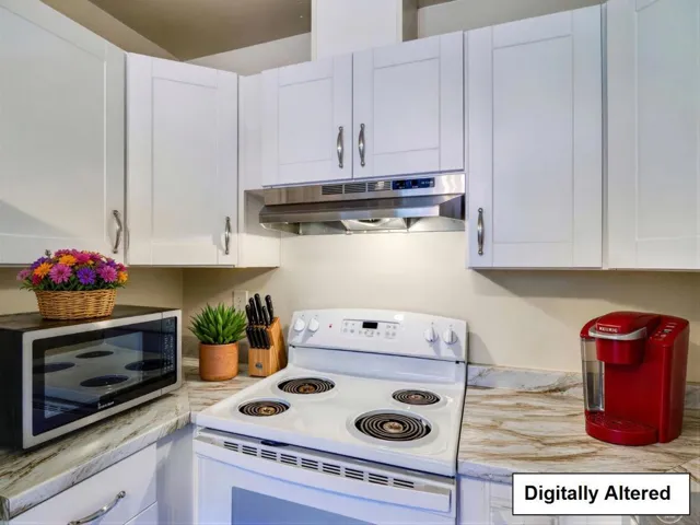 Kitchen with all GE appliances. Digitally Staged.