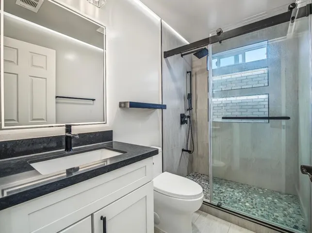 Custom Tile Bath w/2 recess soap boxes.  Recess lighting in bathroom ceiling. Defogger  in mirror