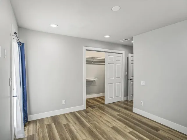 Sliding door closets have recess lites.