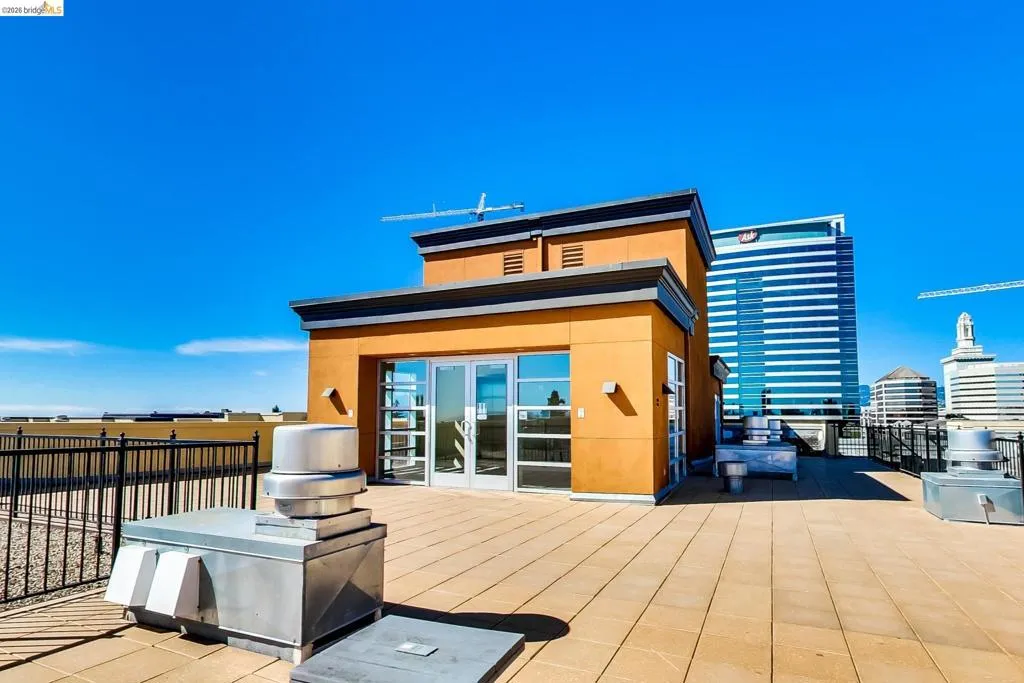Rear view of property featuring a patio, french doors, and stucco siding Rear view of property featuring a patio, french doors, and stucco siding