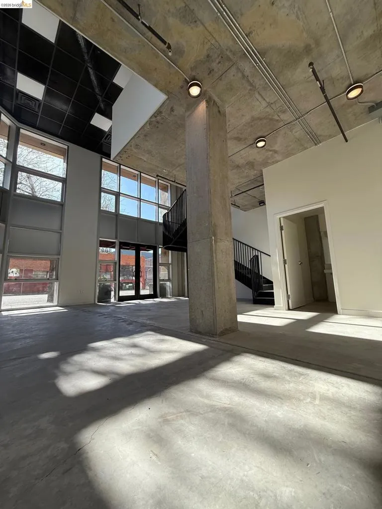 Misc room featuring a high concrete ceiling Misc room featuring a high concrete ceiling
