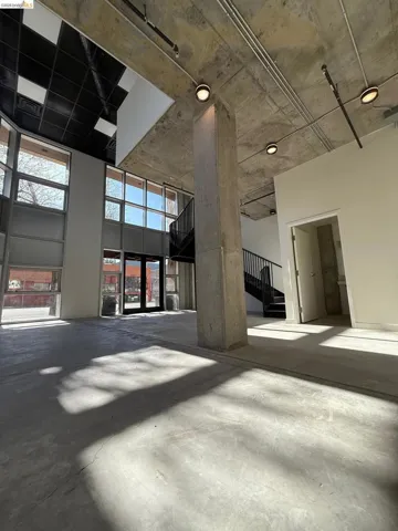 Misc room featuring a high concrete ceiling
