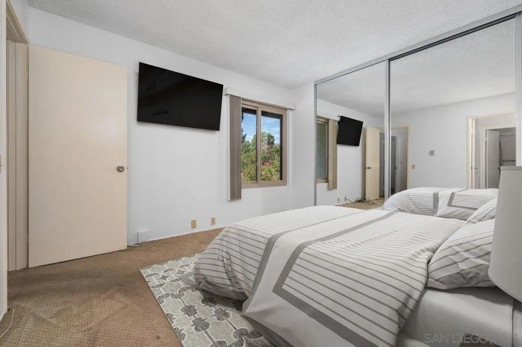 Primary bedroom with flat-screen TV bracket. Virtually staged. Primary bedroom with flat-screen TV bracket. Virtually staged.