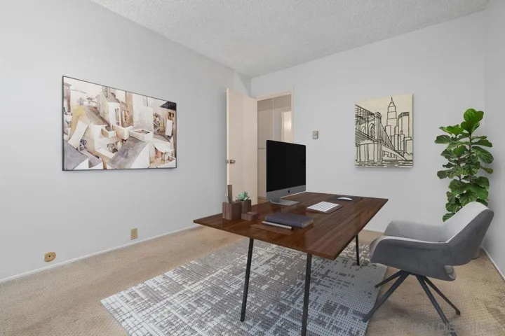 Third bedroom. Virtually staged as a home office.