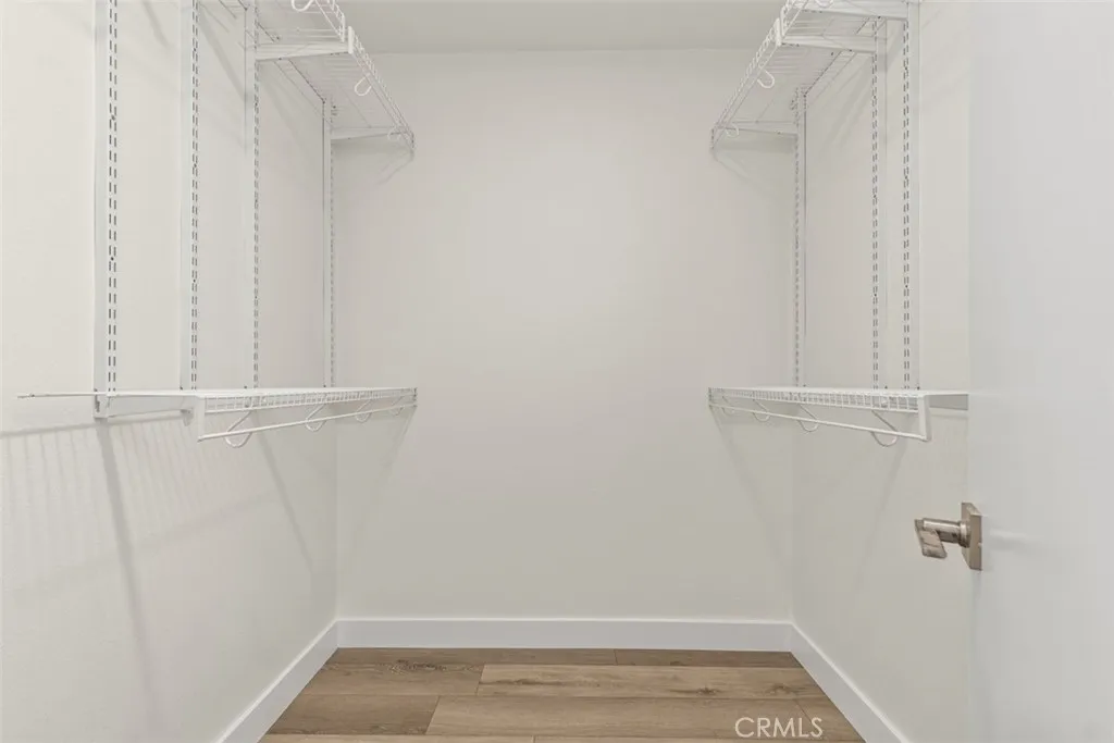 Primary walk-in closet. Primary walk-in closet.