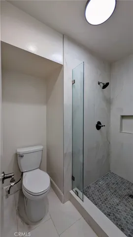 Primary bathroom with newer shower