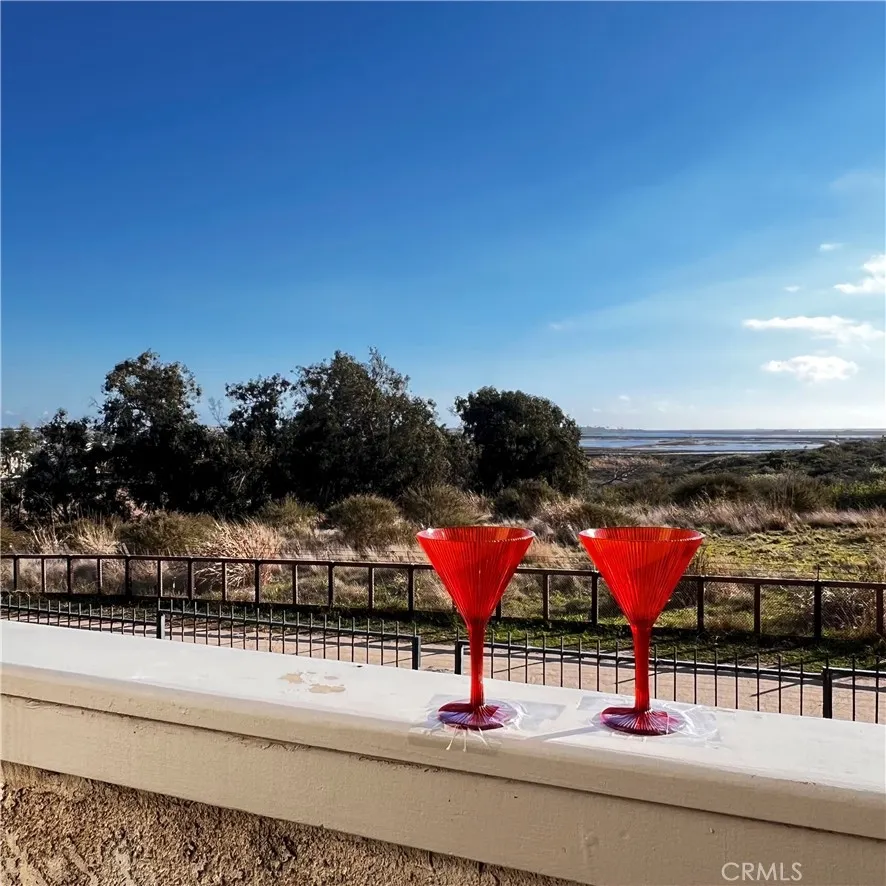 Feel the breeze? Overlooking a walking path, beginning of wetlands and on to the BEACH off of PCH. Feel the breeze? Overlooking a walking path, beginning of wetlands and on to the BEACH off of PCH.