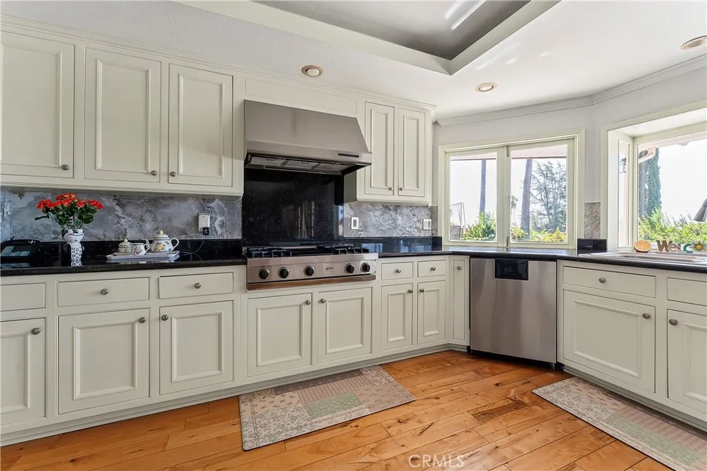 Kitchen with stainless steel appliances and custom cabinetry Kitchen with stainless steel appliances and custom cabinetry