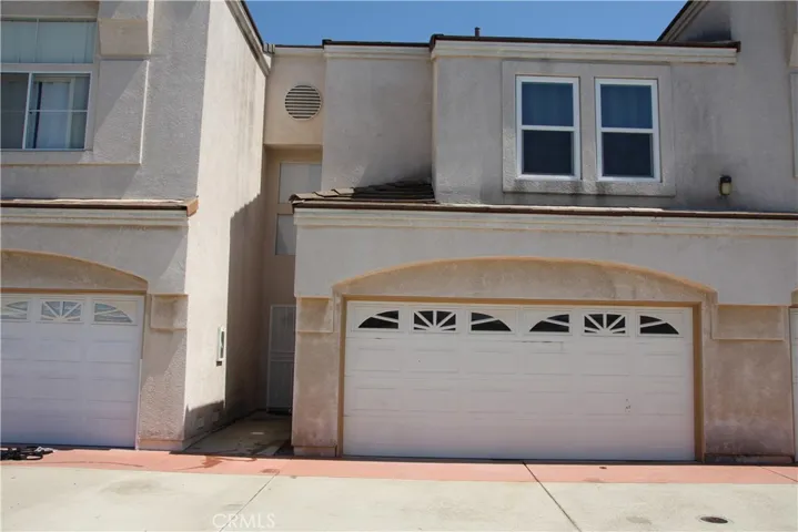 Front of condo 2 car garage