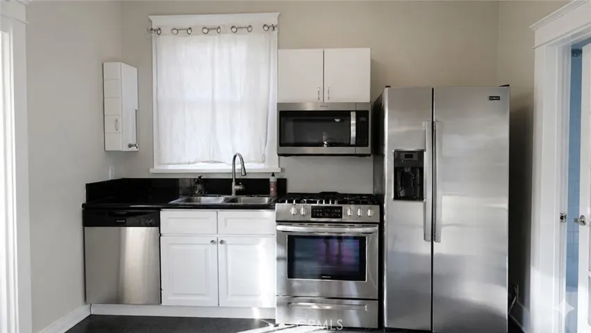 Kitchen, Dishwasher, Microwave, Refrigerator.