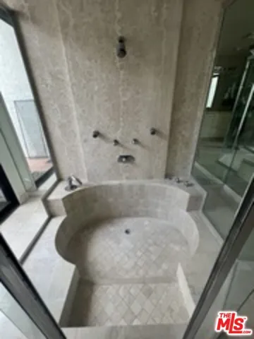 sunk in marble tub/shower