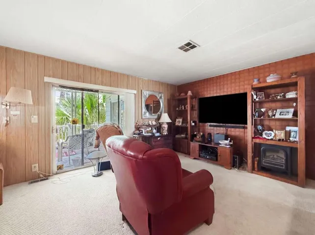 Spacious den with patio access