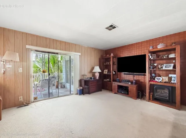 AI Spacious den with patio access