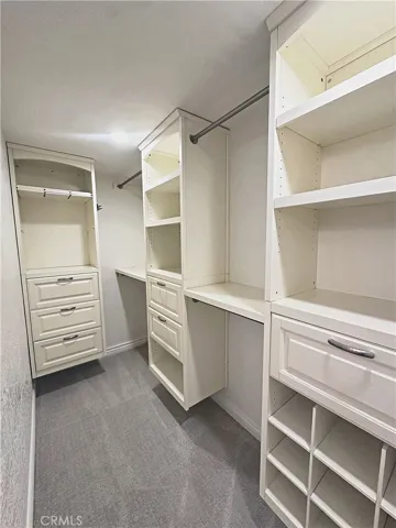 Walk-in closet in primary bedroom