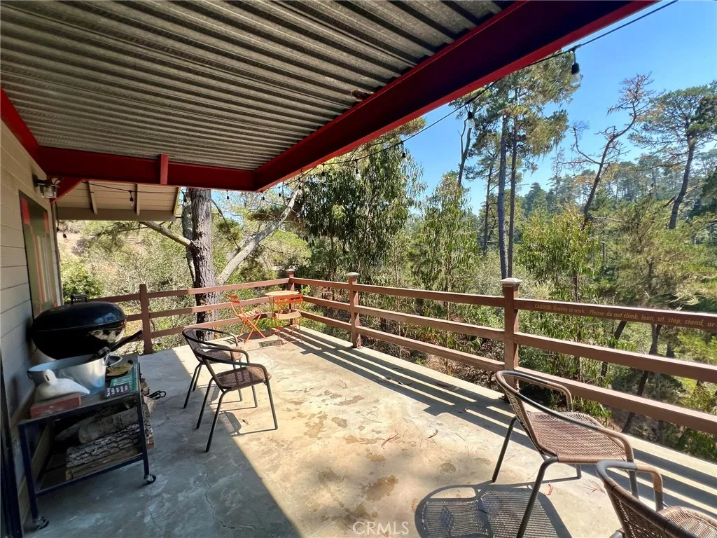 Living room deck, BBQ and deck chairs to use.