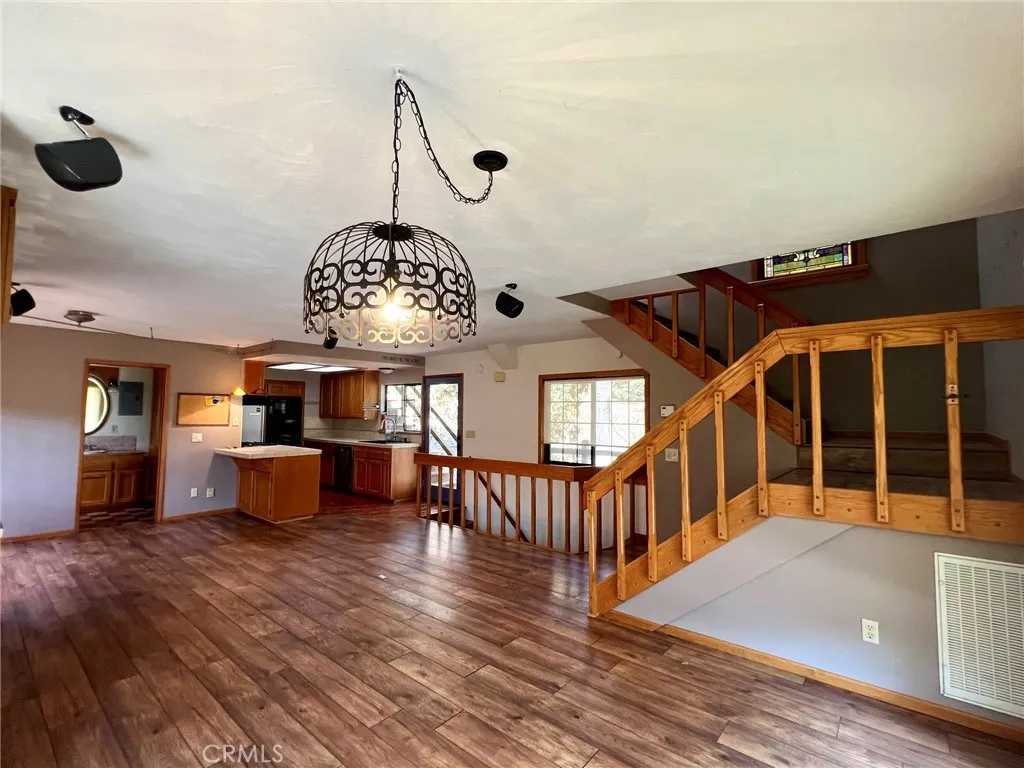 From the corner of the living area, this floor plan is spacious with a sweet galley kitchen and a three-quarter bath