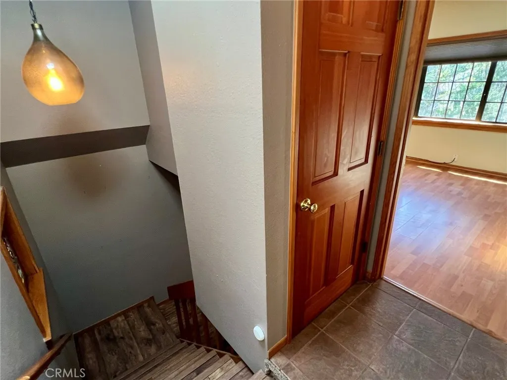 In the hallway going down to the living level of the home.